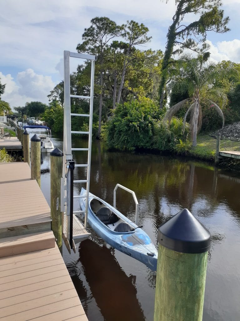 Kayak being lowered into canal