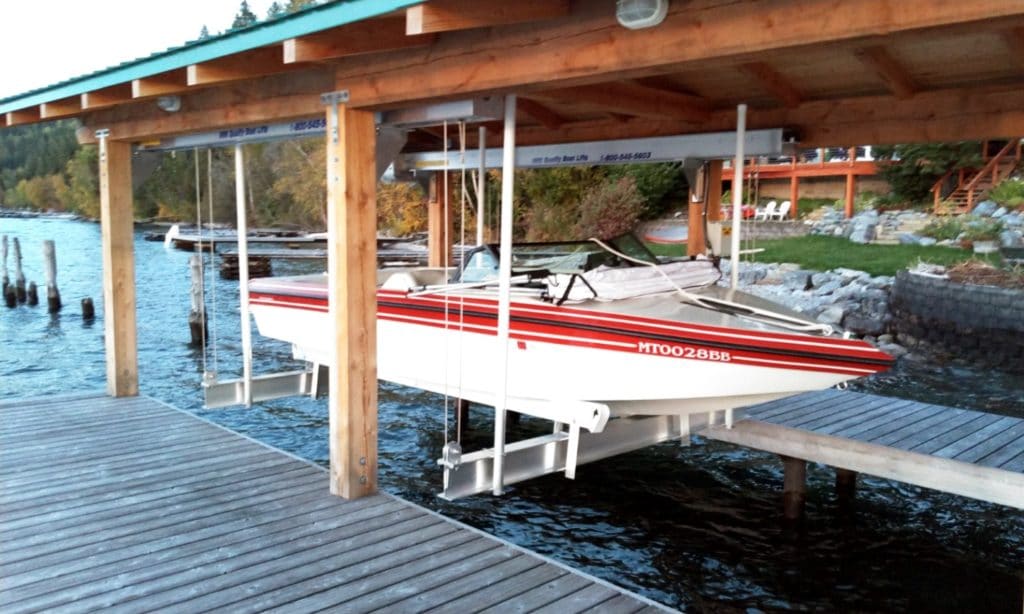 red and white boat uses boathouse lift solution by IMM Quality