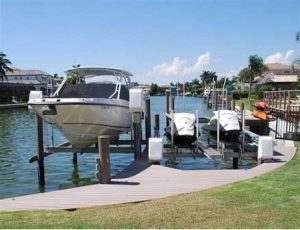 Boat dock with a boat and 2 jet skis