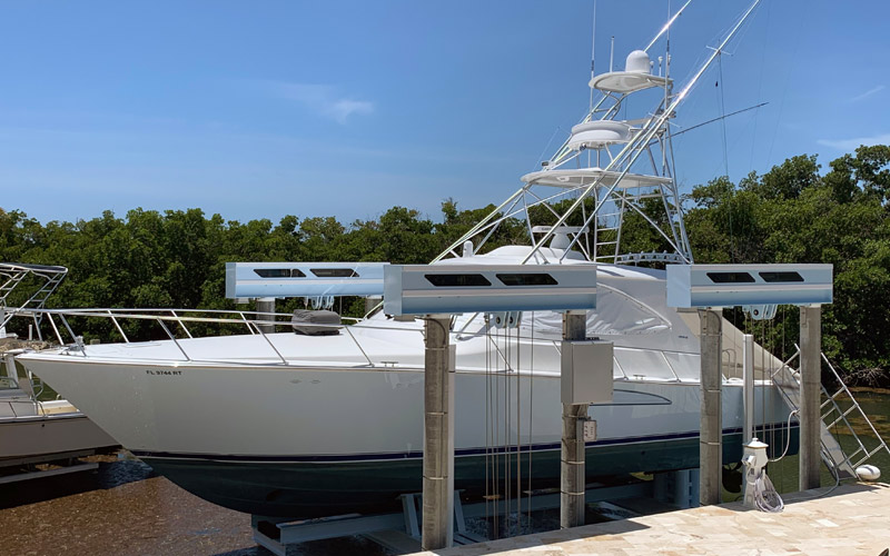 Using a powder coating technique, you can add color to the aluminum structure of your boat lift. Whether you want to match the color of your boat or home, you can literally send the color code of your choice. In the photo below, you can see how we powder coated the powerheads and cradles white and light blue to match the hull of the boat.